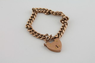 A 9ct gold curb link bracelet with padlock clasp 15.1grams
