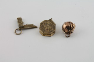 A 9ct gold Masonic ball charm, a yellow metal Masonic locket  and a silver gilt Masonic square