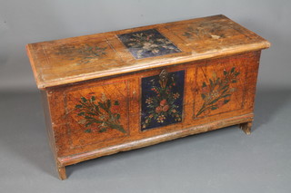 A late 18th/early 19th Century Scandinavian pine coffer  decorated with painted floral panels, the hinged top enclosing a  candle box raised on end stiles 25"h x 51"h x 21"d