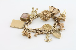 A 9ct gold curb link charm bracelet with padlock clasp hung 13 various charms, approx 54.2grams