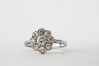 An Art Deco platinum colette diamond set dress ring