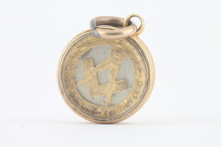 A "gold" Masonic pendant in the form of a square and compass