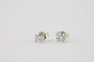 A pair of 18ct white gold diamond stud earrings