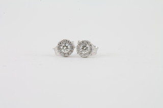 A pair of 14ct gold diamond set ear studs approx