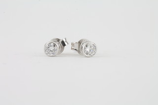 A pair of 18ct white gold brilliant diamond set ear studs, approx 0.42ct