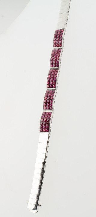 An 18ct white gold bracelet set rubies, approx 22.9grams  ILLUSTRATED