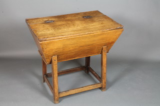 A mid 18th Century oak and elm dough bin having hinged top,  raised on square moulded legs united by stretchers, 31"h x 34"w  x 22"d