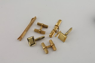 A pair of modern 18ct gold cufflinks 12.9grams, a Continental gold tie clip, a yellow metal tie clip, a pair of yellow metal  cufflinks and a gold and pearl stud