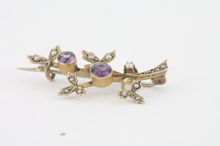 A 9ct gold floral spray brooch set amethysts and pearls