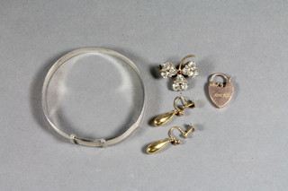 A 9ct gold padlock clasp, a pair of 9ct gold drop earrings, a silver bracelet and a clover shaped brooch set paste