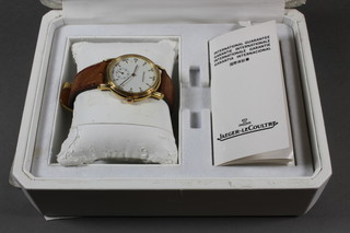 A gentleman's Jaeger LeCoultre Odysseus wristwatch contained  in an 18ct gold case with leather strap and 18ct gold buckle,  boxed