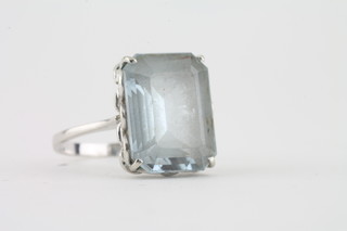 An 18ct white metal dress ring set a rectangular cut white sapphire