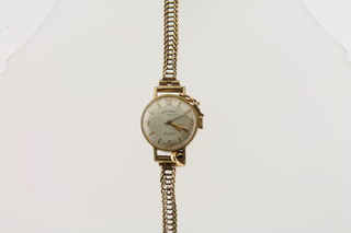 A Rotary wristwatch contained in a 9ct gold case with integral bracelet