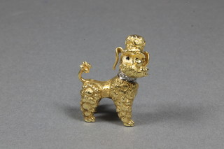 An 18ct gold brooch in the form of a standing poodle with  diamond set collar, having a swivel head  ILLUSTRATED