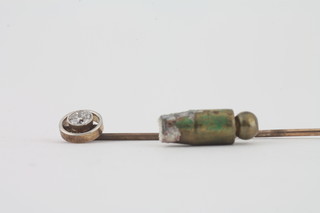 A diamond set stick pin