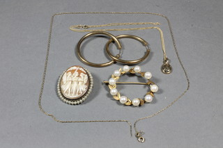 A pair of 9ct gold hoop earrings 2.4grams, a fine gold chain, a yellow metal and pearl set brooch and a shell carved cameo  brooch