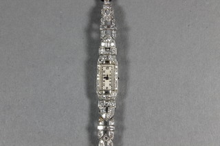 An Art Deco lady's white metal cocktail wristwatch set diamonds
