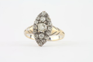 A lady's marquise shaped dress ring set diamonds