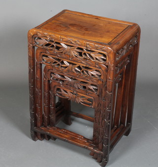 A quartetto of Japanese carved Padouk wood tea tables with  simulated bamboo decoration, the largest 28"h x 19"w x 14"d