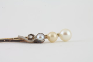 A gold pearl and diamond set stock pin and 2 other stock pins set pearls
