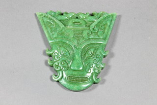 A jade pendant in the form of a mask 3"
