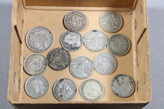 A collection of silver threepences and an Australian silver sixpence