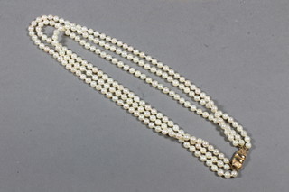A 3 strand pearl necklace