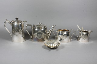A 4 piece Britannia metal oval tea service with teapot, hotwater jug, sugar bowl and milk jug, a scallop shaped butter dish and a  set of 6 silver plated tea knives and cake forks