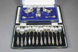 A set of 12 silver bright cut coffee spoons together with a 3 piece silver condiment set comprising mustard, salt and pepper with 2  condiment spoons, Birmingham, 9 ozs