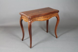 A 19th Century French walnut card table in the Louis XV style,  the hinged top enclosing a baise lined interior and enclosing a  counter drawer, raised on moulded cabriole legs 29.5"h x 34"w x  36"d