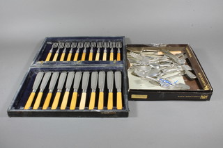 A set of 11 silver plated fish knives and forks, cased together with a small collection of silver plated flatware