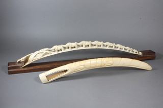 A carved ivory bridge of elephants and a figure of a crocodile