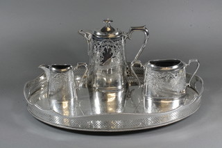A Britannia metal oval engraved coffee pot, sugar bowl and  cream jug and an oval silver plated tea tray 20"