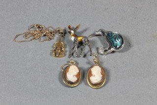 A 9ct gold pendant in the form of a violin hung on a fine gold chain 3 grams, a pair of oval shell carved cameo portrait  earrings, a Continental enamelled brooch in the form of a faun  and a brooch in the form of a Kiwi