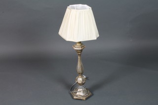 An 18th Century style Italianate silvered giltwood candlestick lamp of faceted form, raised on hexagonal plinth base 29"h