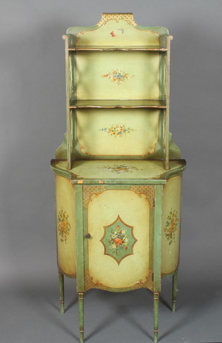An early 20th Century pale green and floral painted chiffonier,  the upper section with 2 shaped shelves above a cupboard door,  raised on ring turned tapered legs 59"h x 25"w x 15"d   ILLUSTRATED