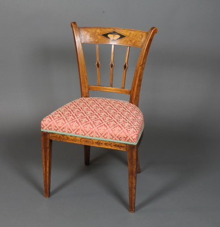 An early 19th Century Italian elm and fruitwood dining chair, the  tablet cresting rail centred with a marquetry butterfly within  foliate reserves, above a stuff over seat and raised on square  tapered legs