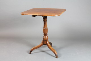 A George III mahogany tilt top tea table raised on a turned column support, tripod base, 28"h x 24"w x 23"d