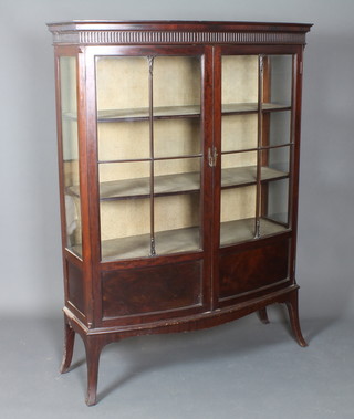 A 1920's George III style mahogany display cabinet, having  fluted cornice above a pair of bar glazed doors enclosing 3  shelves, raised on splayed legs 62"h x 46"w x 17"d