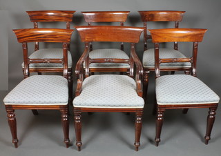 A set of 6 William IV style mahogany dining chairs, 1 having  arms, with plain cresting rails above rosette carved spars, stuff  over seats, raised on lapit carved turned legs