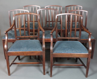 A set of 8 George III mahogany dining chairs, 2 having arms,  with moulded spindle backs, drop in seats, raised on square  tapered legs