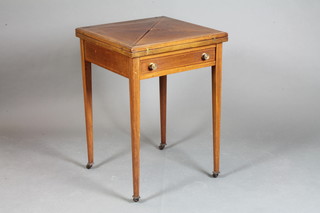 An Edwardian inlaid mahogany envelope card table fitted a frieze drawer, raised on square tapering supports, brass caps and casters  29"h x 20"w