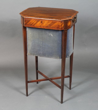 A George III mahogany work table of octagonal form, satinwood crossbanded, hinged top, above linen basket raised on square  tapered legs united by an X stretcher 30"h x 18"w x 13.5"d