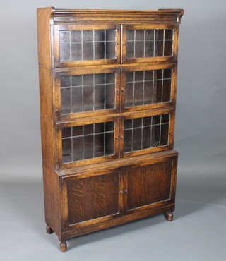A Globe Wernicke style 4 section oak library bookcase, each  section with a pair of lead glazed doors 59"h x 35"w x 12"d