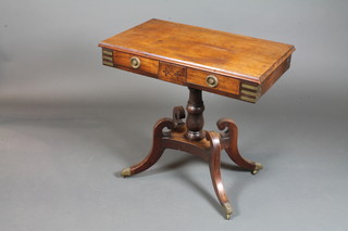 A George IV mahogany side table, brass mounted fitted 2 short drawers raised on a quadripartite splayed base, later top 28"h x  30"d x 17.5"w