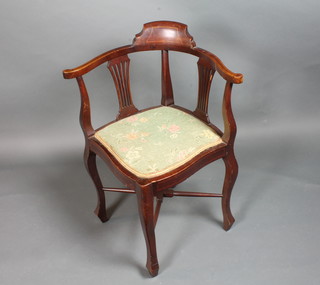 A Victorian inlaid mahogany corner chair with pierced splat back and upholstered seat with X framed stretcher, raised on cabriole  supports