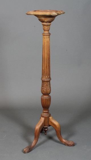 A late 19th Century mahogany torchere in the mid 18th Century  style, the shaped square top raised on a fluted leaf acanthus  carved column support, tripod base, 46"h x 11"w