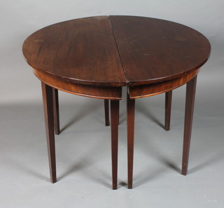 A late George III mahogany D end extending dining table, the centre section with drop leaves, raised on square tapered legs  28"h x 44.5"d x 91"l