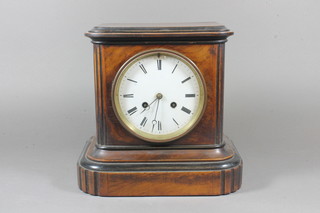 A Victorian walnut and parcel ebonised mantel clock having a  Roman enamelled dial set 8 day cylinder movement and chiming  gong, 9.5"h x 10"w x 6.5"d