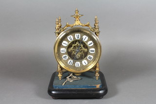 A late 19th Century French gilt brass desk clock in the Oriental taste, having a foliate embossed dial with inset Roman enamelled  tablets and visible deadbeat escapement, the movement signed  Fot-Bte 7.5"h x 5"w x 4"d